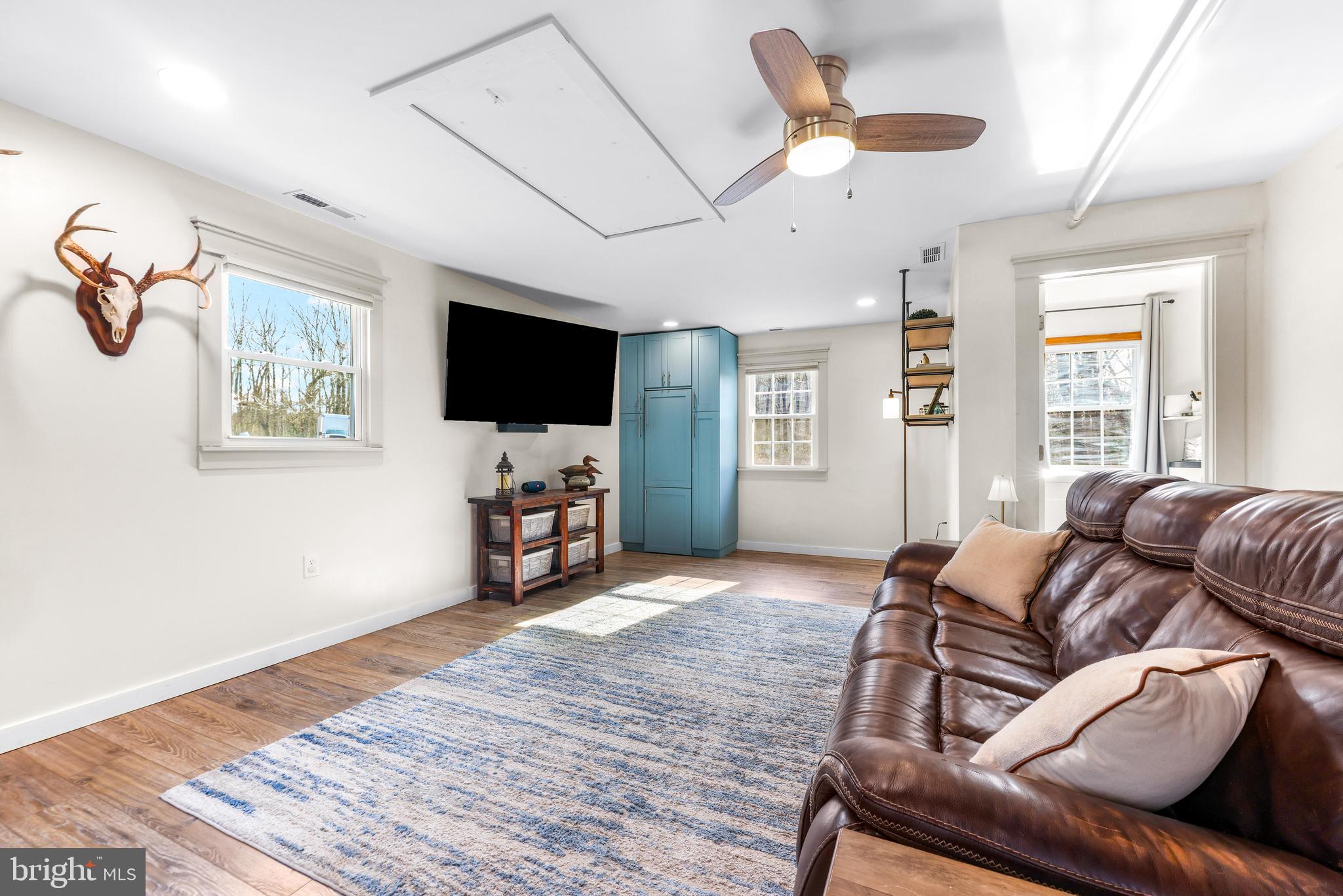 6204 Ebenezer Road Middle River, MD 21220 - Photo 31 of 70 a living room with furniture and a flat screen tv