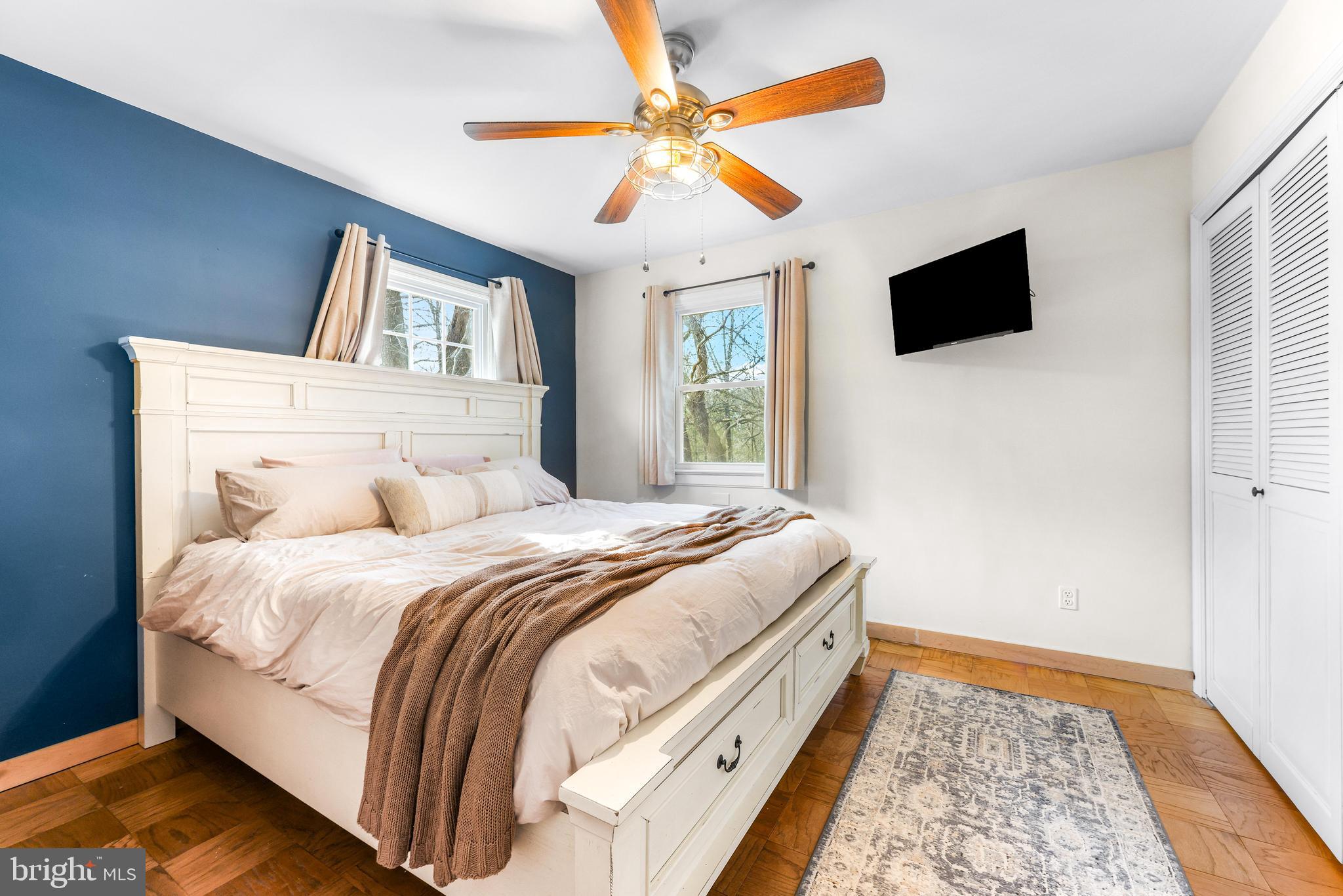 6204 Ebenezer Road Middle River, MD 21220 - Photo 39 of 70 a bedroom with a bed and a flat screen tv