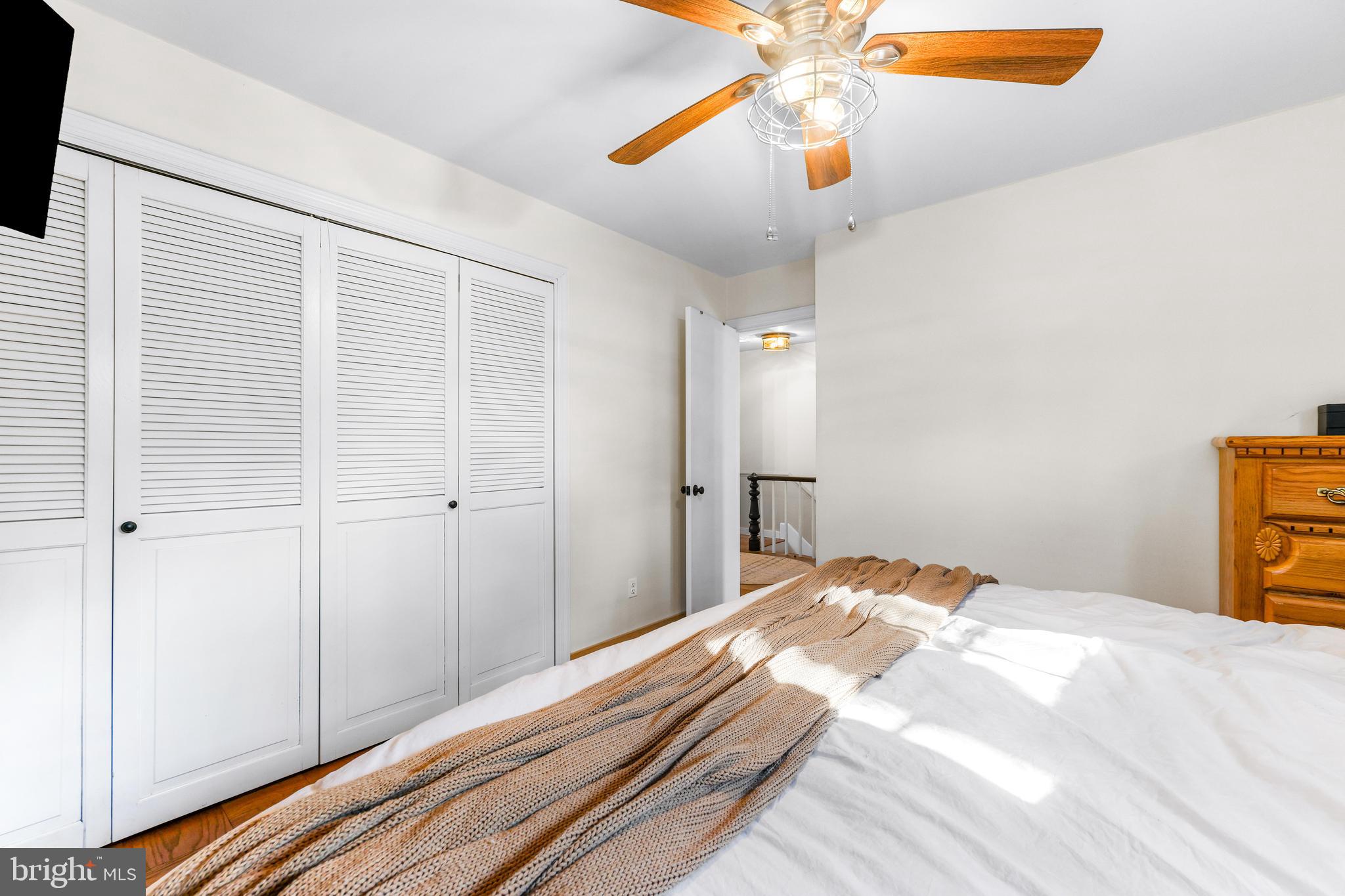 6204 Ebenezer Road Middle River, MD 21220 - Photo 40 of 70 a bedroom with a bed and a chandelier