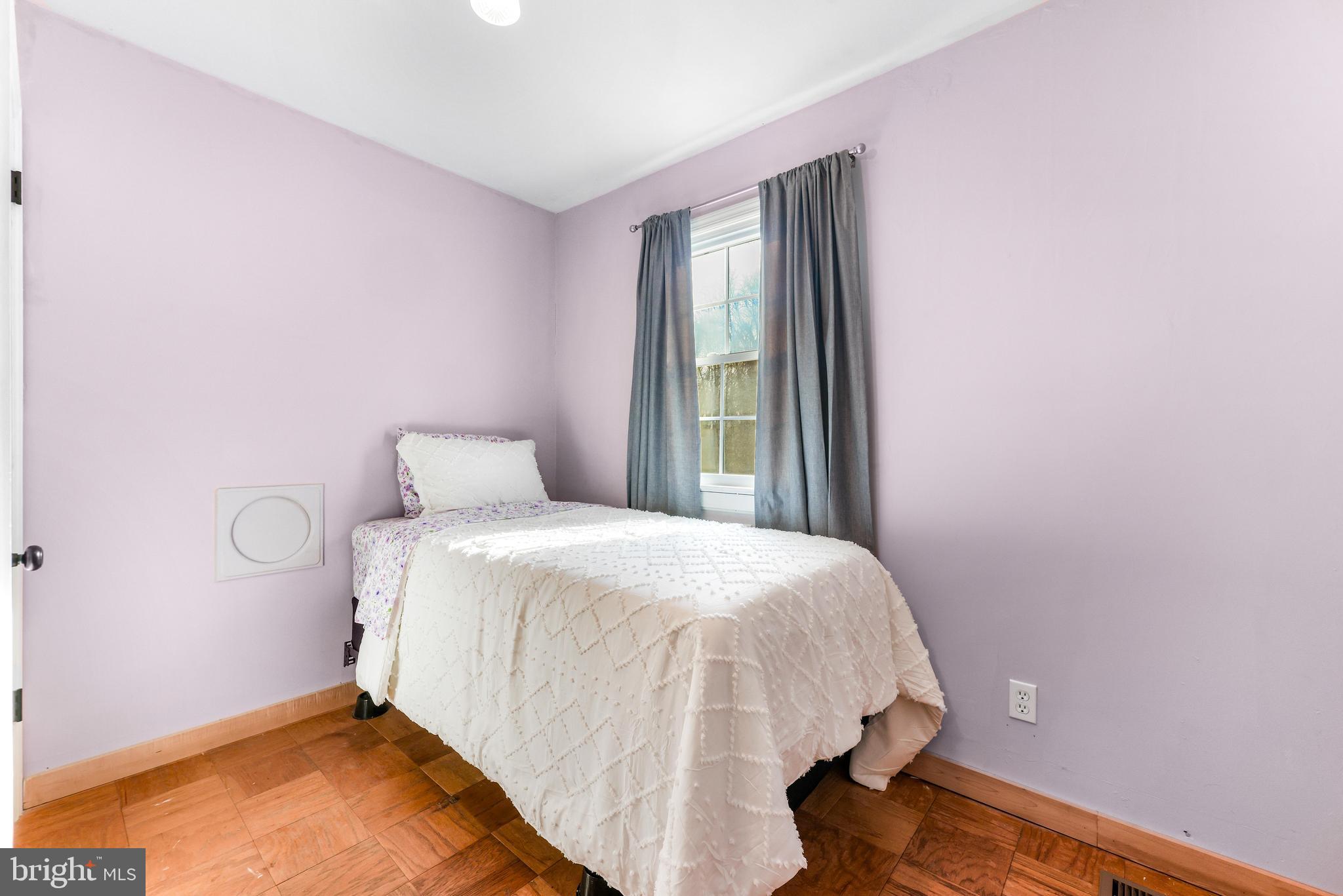 6204 Ebenezer Road Middle River, MD 21220 - Photo 41 of 70 a bedroom with a bed and a window