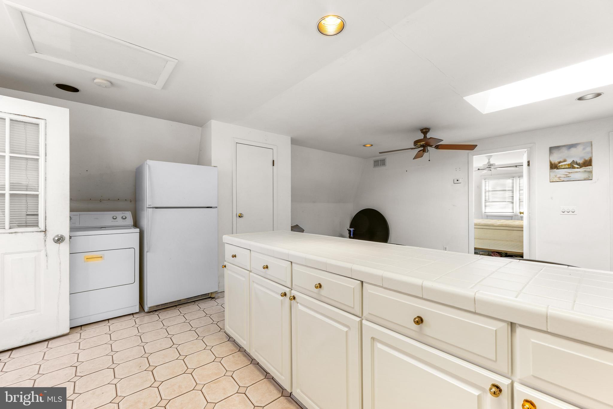 6204 Ebenezer Road Middle River, MD 21220 - Photo 50 of 70 a kitchen with a refrigerator and a stove