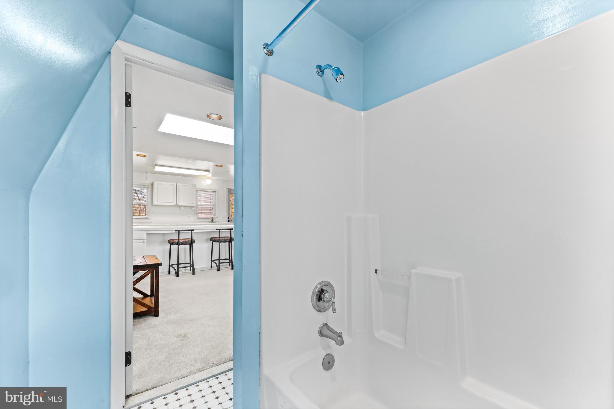 6204 Ebenezer Road Middle River, MD 21220 - Photo 56 of 70 a bathroom with a tub and shower