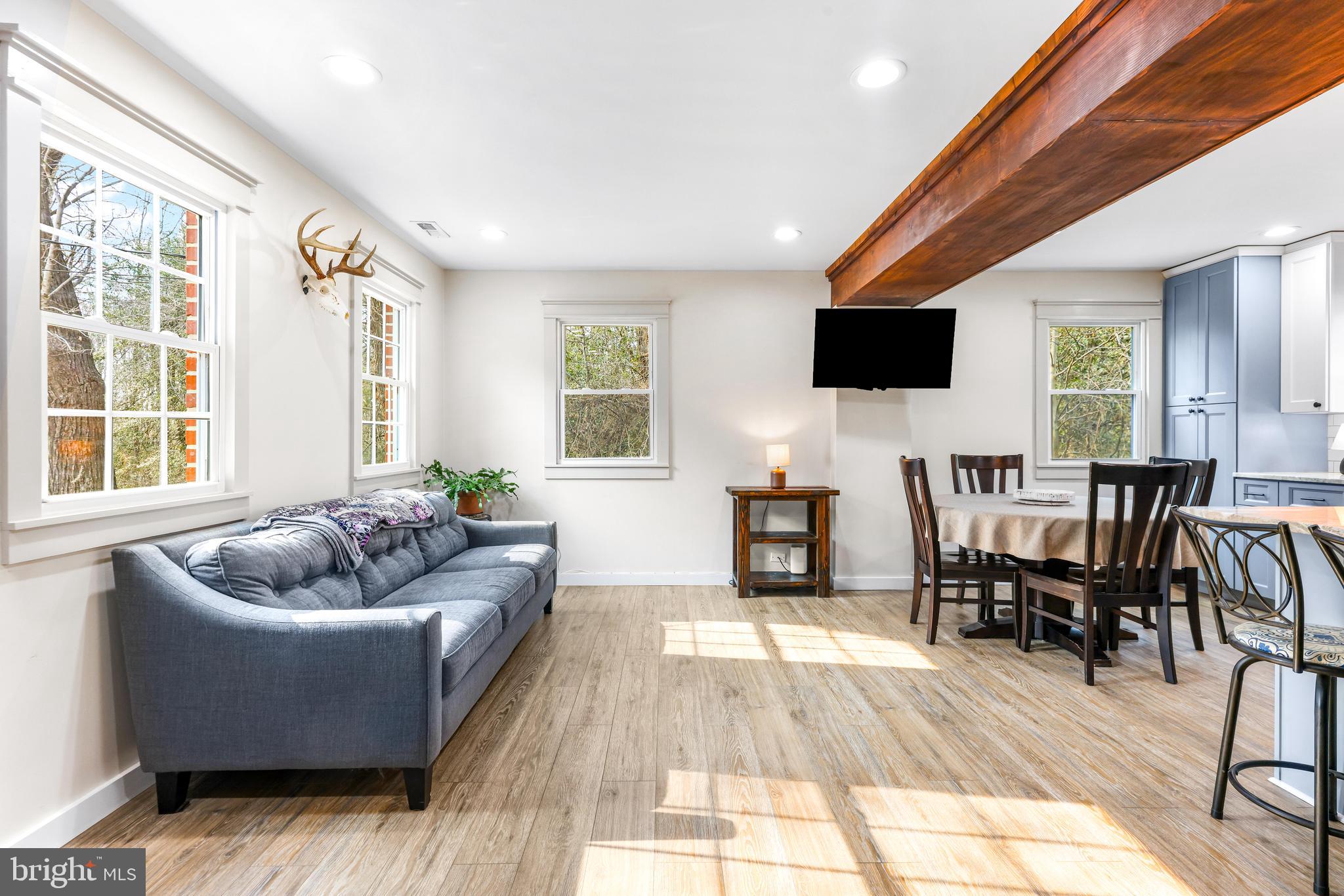 6204 Ebenezer Road Middle River, MD 21220 - Photo 10 of 70 a living room with furniture and a flat screen tv