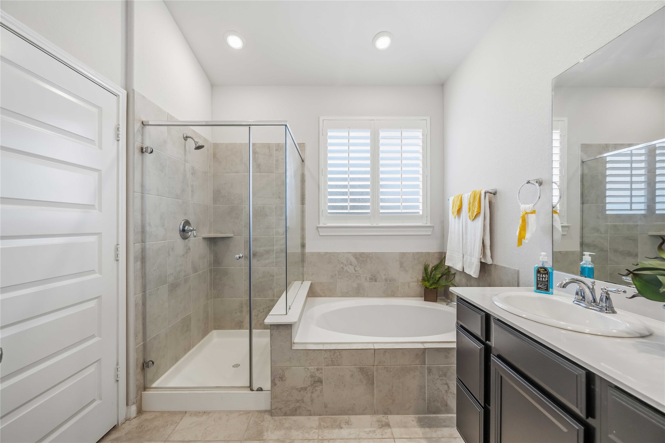 2425 Temple Crag Drive Rosharon, TX 77583 - Photo 15 of 32 Well-appointed primary bath offers comfort, functionality, and plenty of space to start your day.
