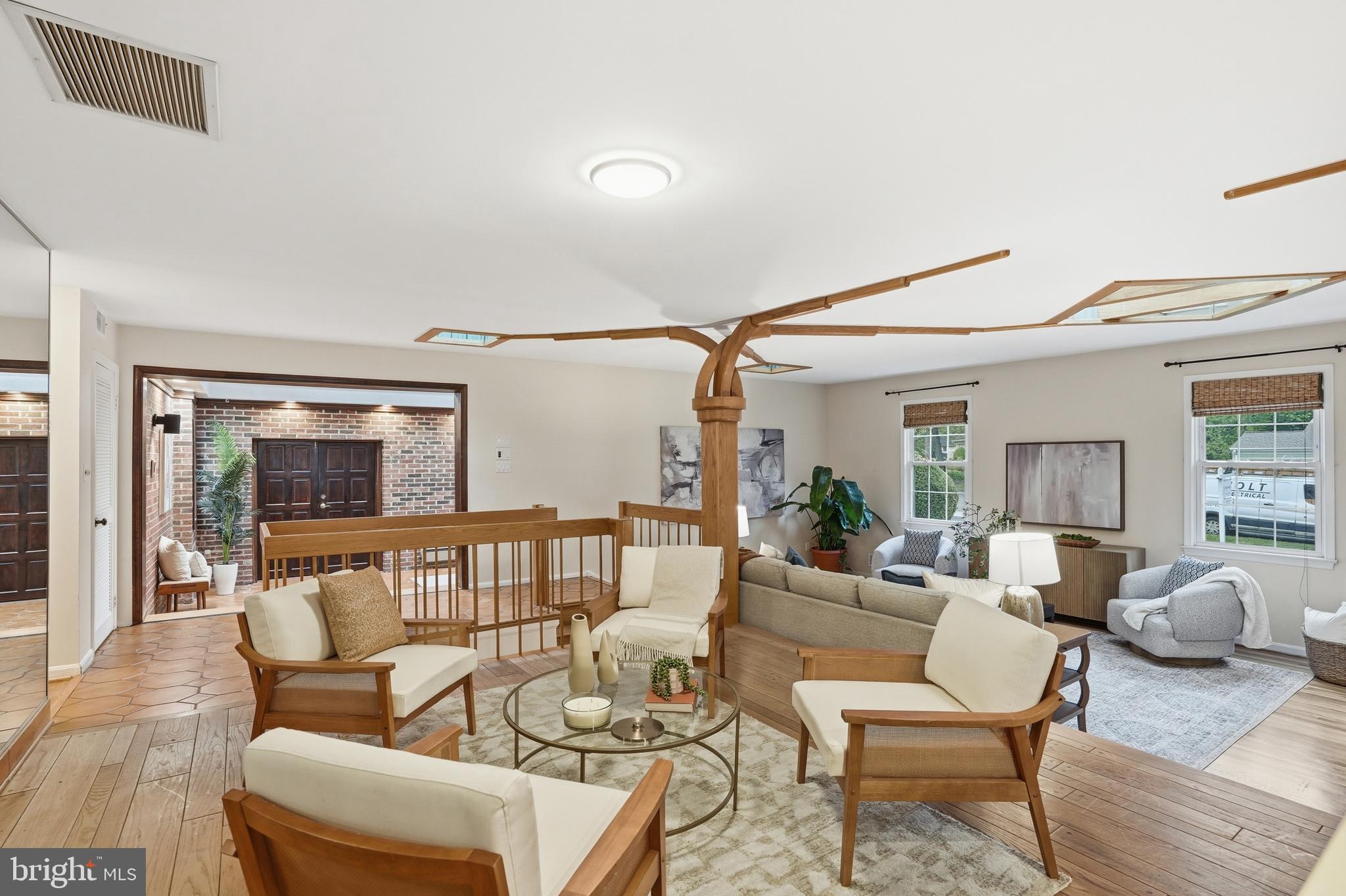 9614 Percussion Way Vienna, VA 22182 - Photo 12 of 45 a living room with furniture and a large window