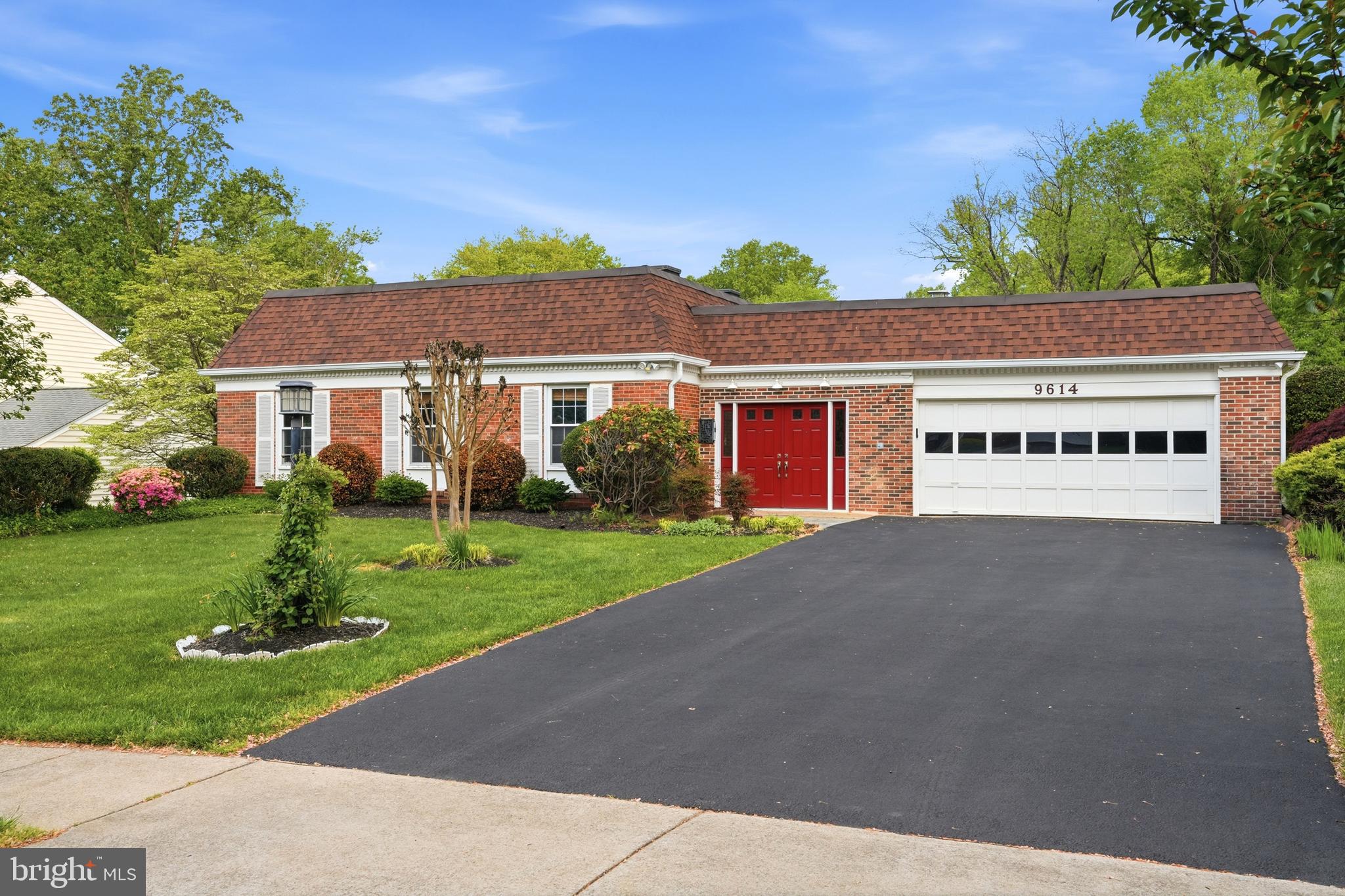 9614 Percussion Way Vienna, VA 22182 - Photo 2 of 45 front view of a house with a yard