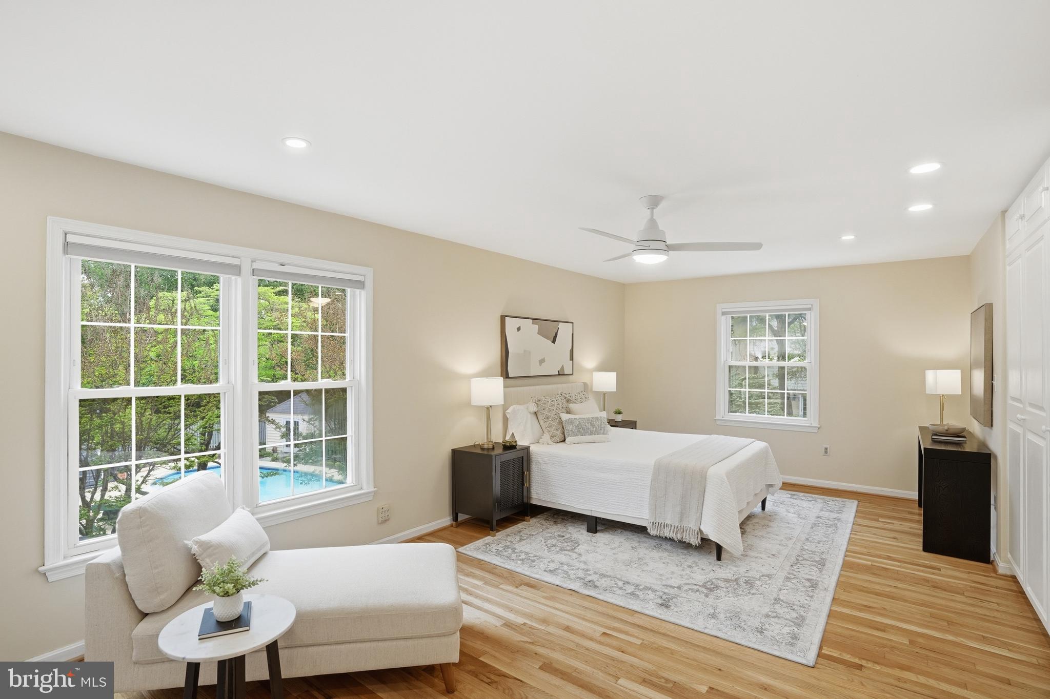 9614 Percussion Way Vienna, VA 22182 - Photo 20 of 45 a spacious bedroom with a bed and glass window