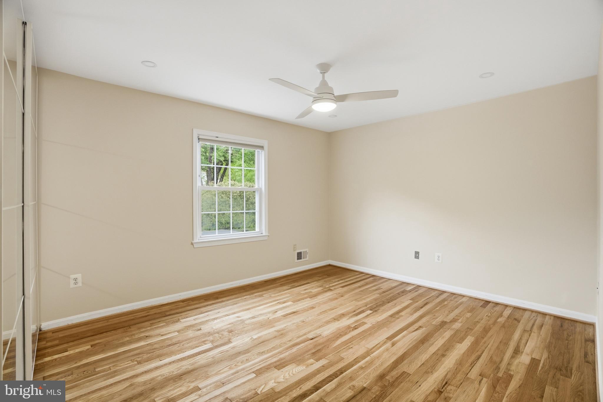 9614 Percussion Way Vienna, VA 22182 - Photo 24 of 45 wooden floor in an empty room with a window