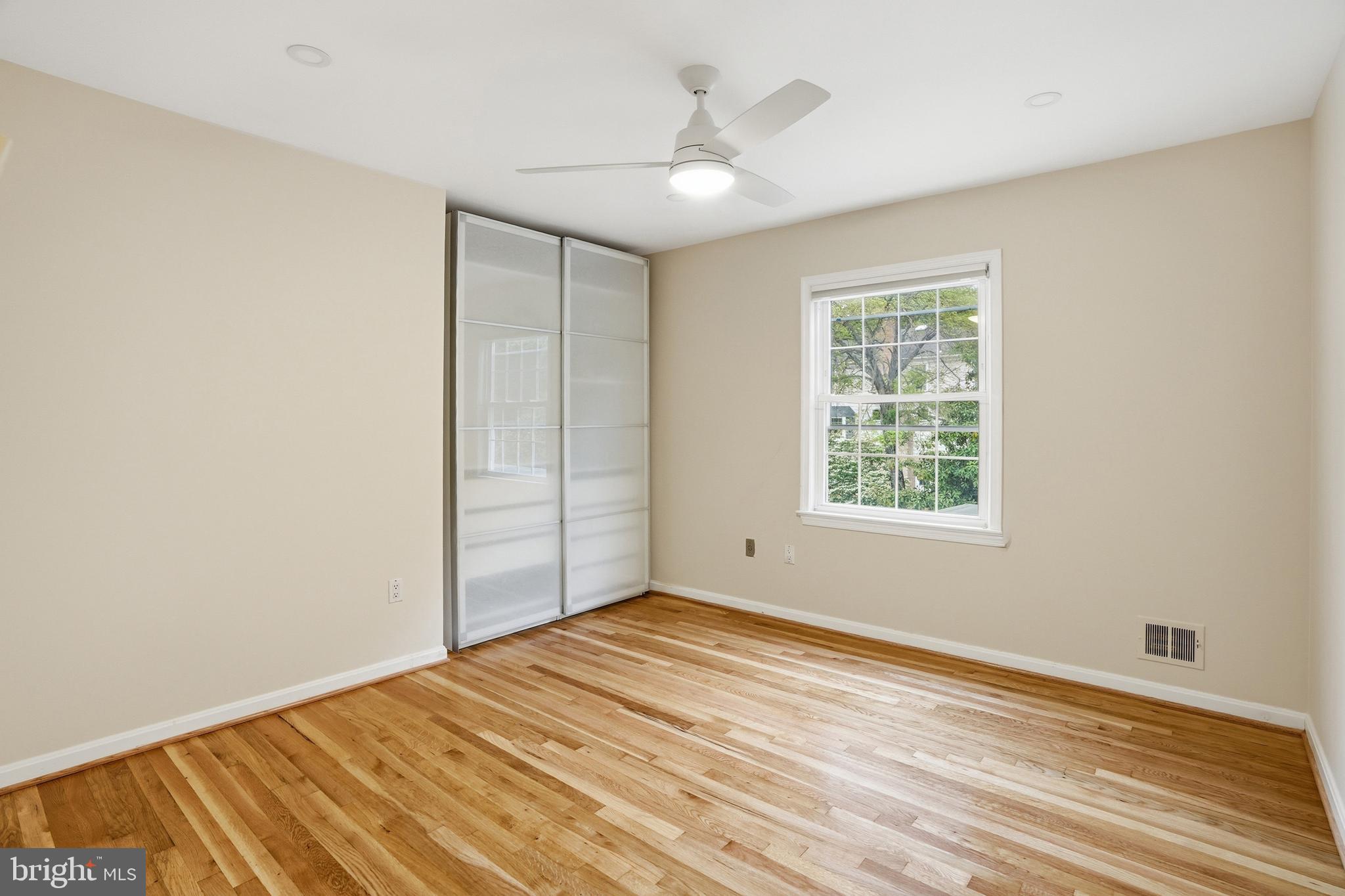 9614 Percussion Way Vienna, VA 22182 - Photo 26 of 45 wooden floor in an empty room with a window