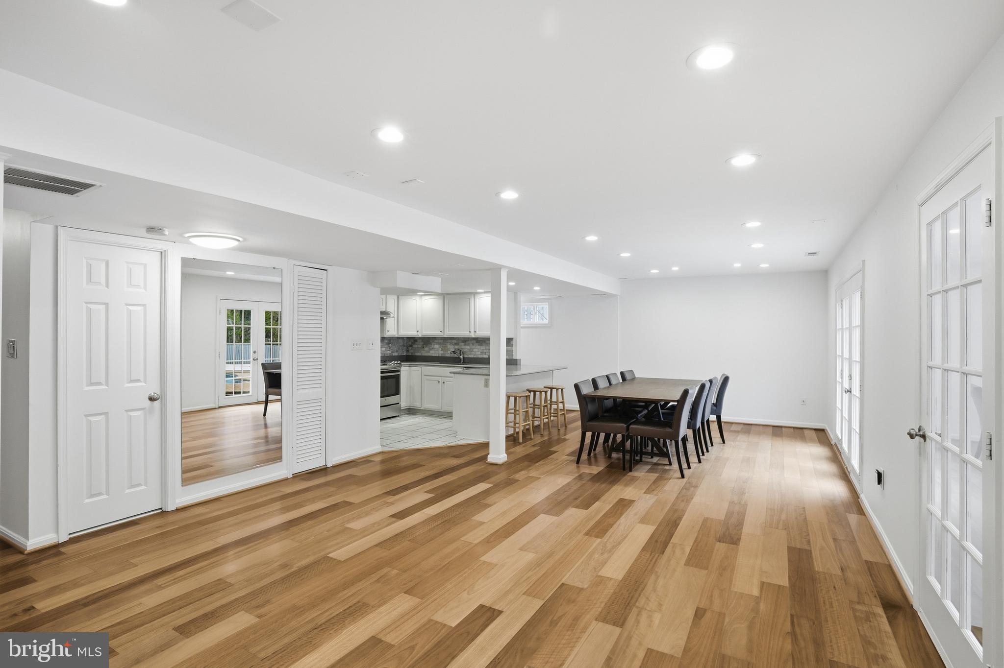9614 Percussion Way Vienna, VA 22182 - Photo 29 of 45 a view of a dining room with furniture wooden floor and a rug