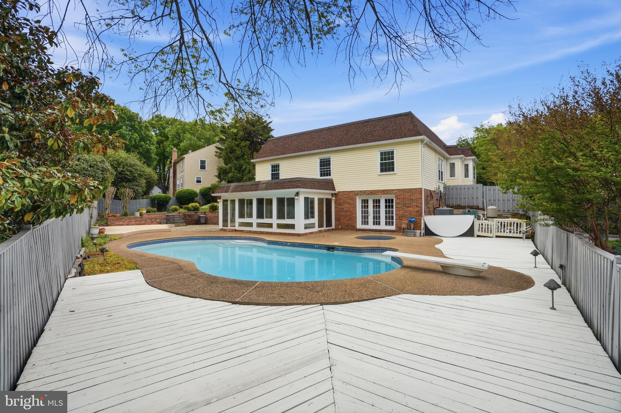 9614 Percussion Way Vienna, VA 22182 - Photo 40 of 45 a front view of a house with swimming pool