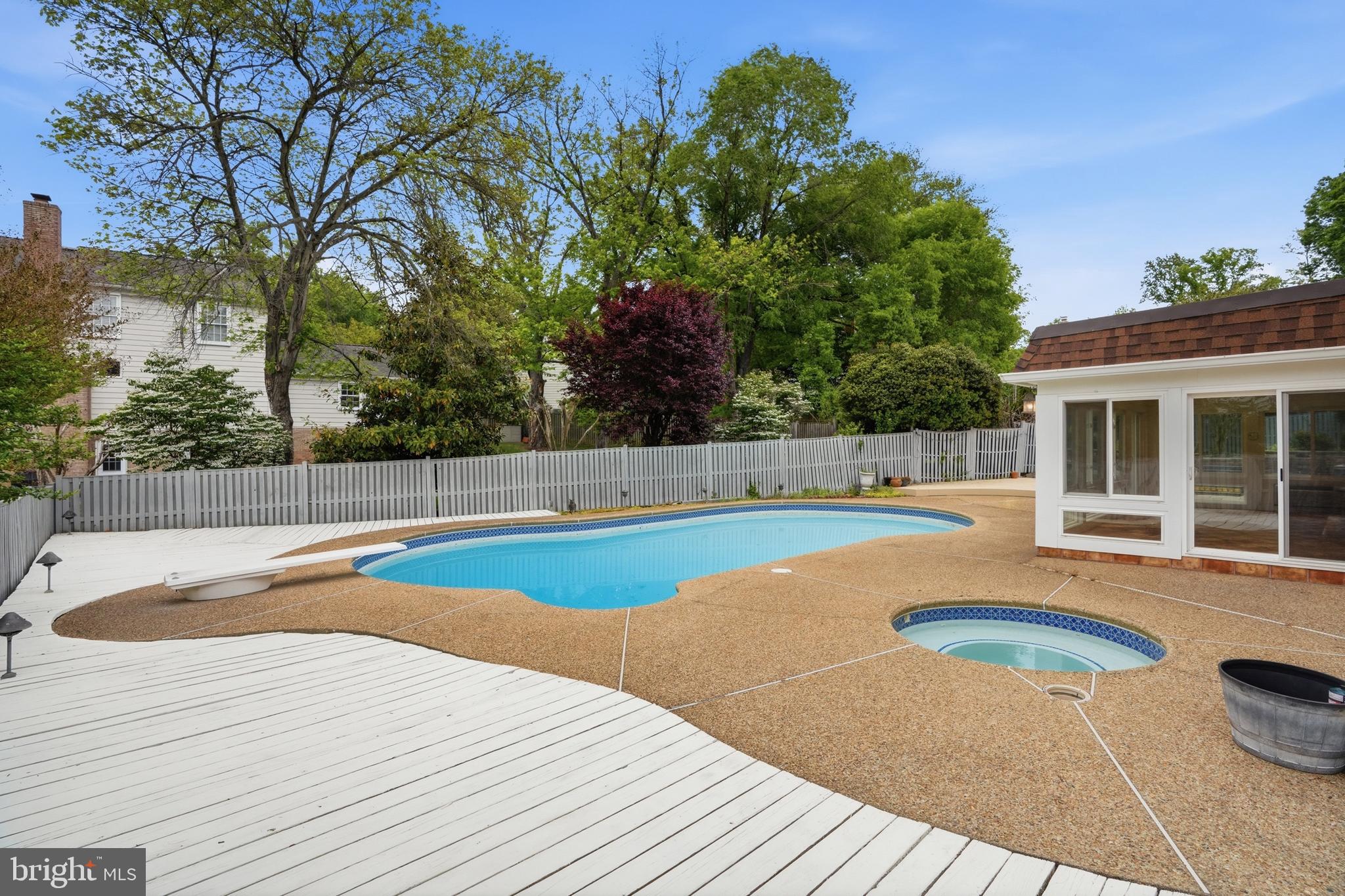 9614 Percussion Way Vienna, VA 22182 - Photo 41 of 45 a view of a swimming pool with a lounge chair