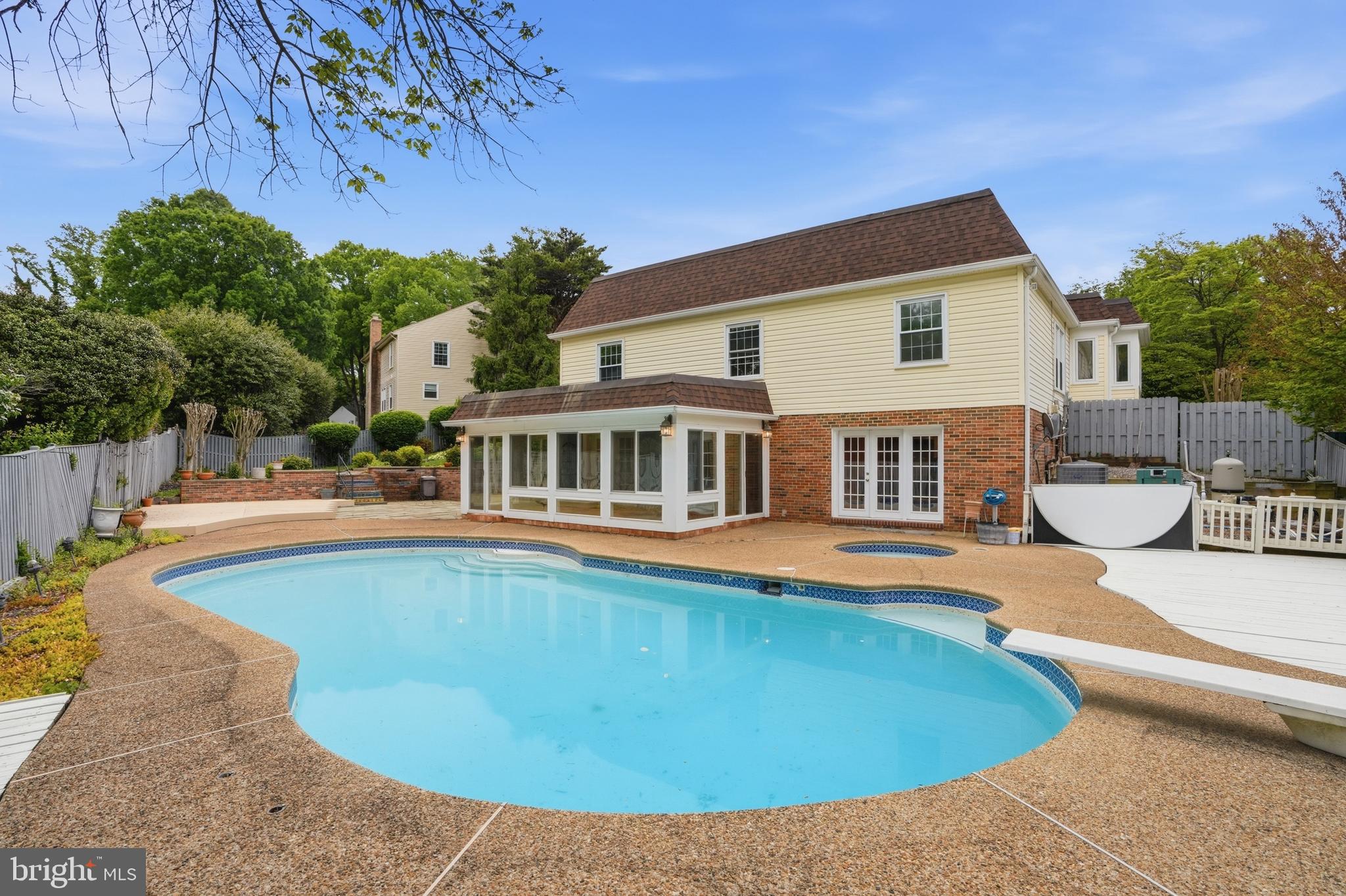 9614 Percussion Way Vienna, VA 22182 - Photo 42 of 45 a view of a house with pool and chairs