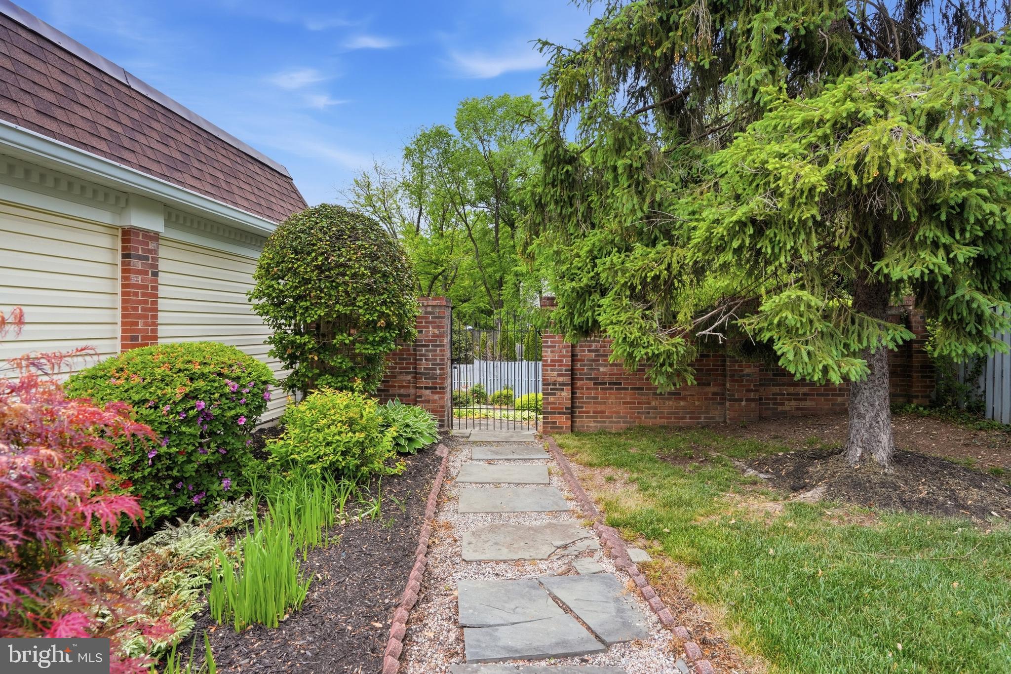 9614 Percussion Way Vienna, VA 22182 - Photo 44 of 45 a pathway of a house with a yard