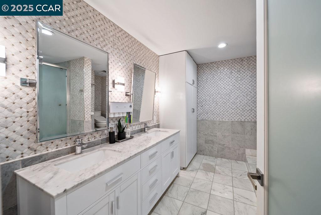 172 Rudgear Drive Walnut Creek, CA 94596 - Photo 14 of 51 a bathroom with a sink and a mirror