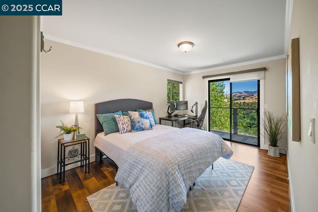 172 Rudgear Drive Walnut Creek, CA 94596 - Photo 15 of 51 a bedroom with a bed and large window