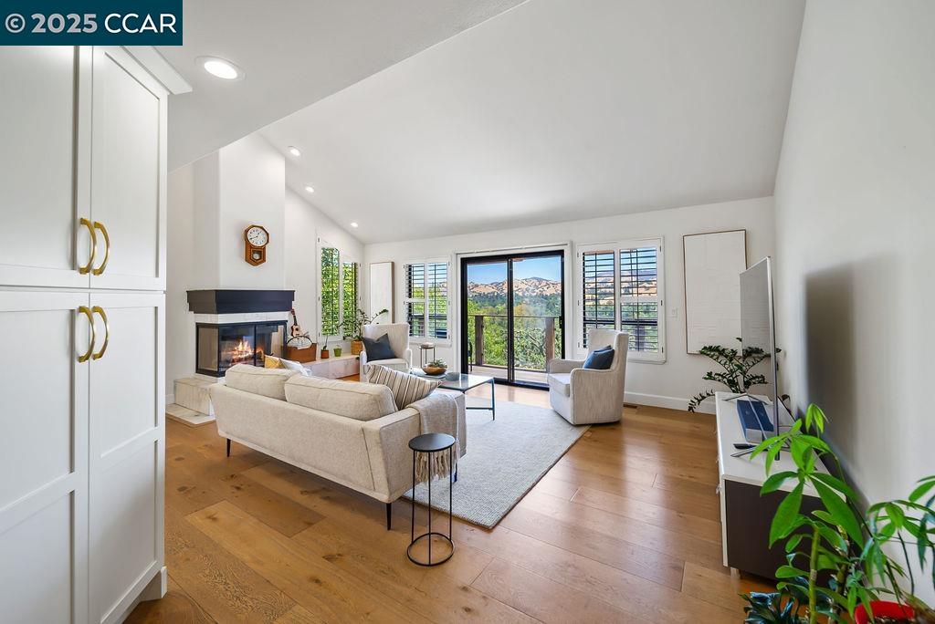 172 Rudgear Drive Walnut Creek, CA 94596 - Photo 18 of 51 a living room with furniture fireplace and windows