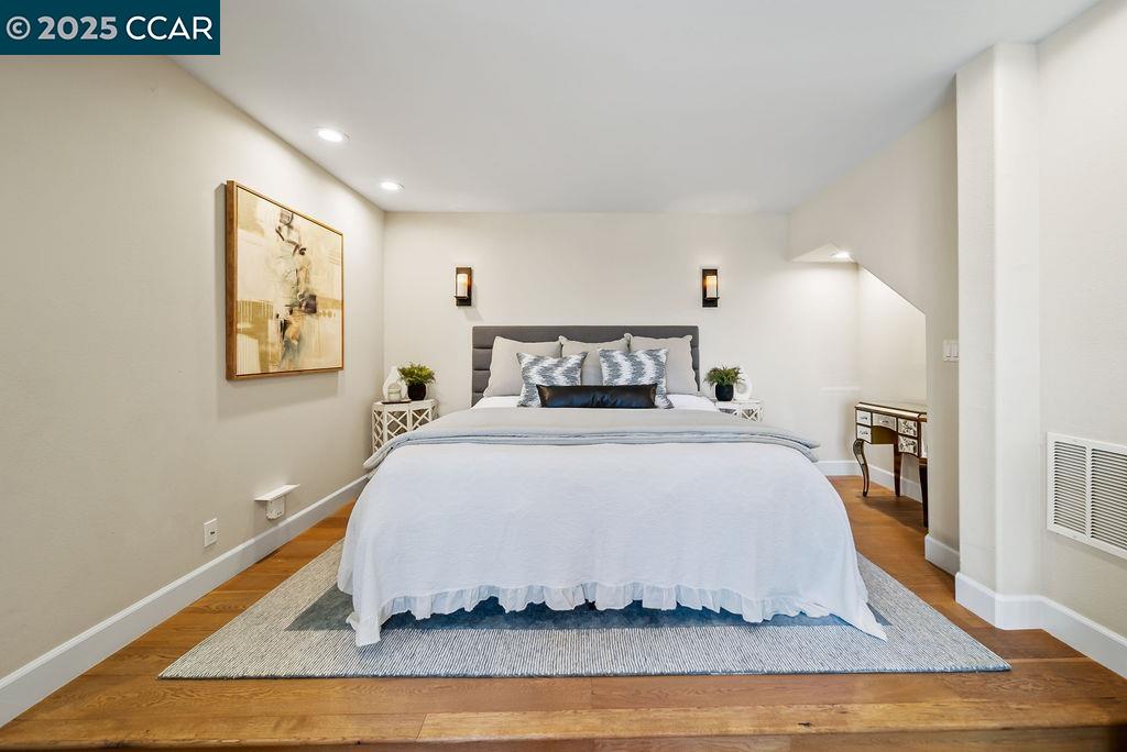 172 Rudgear Drive Walnut Creek, CA 94596 - Photo 28 of 51 a bedroom with a bed and wooden floor