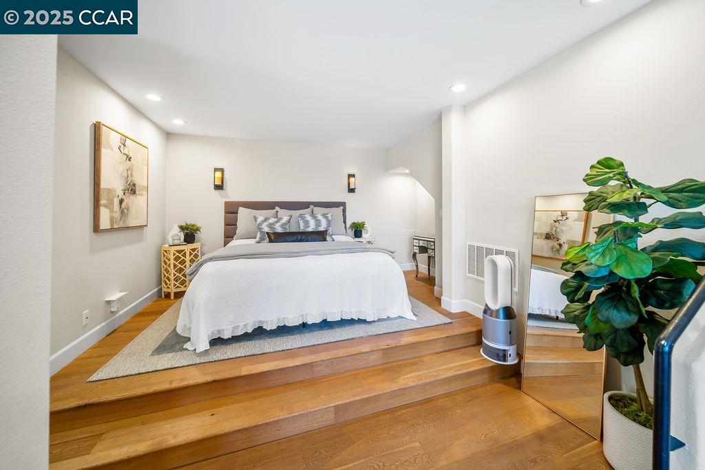 172 Rudgear Drive Walnut Creek, CA 94596 - Photo 29 of 51 a spacious bedroom with a bed and a potted plant