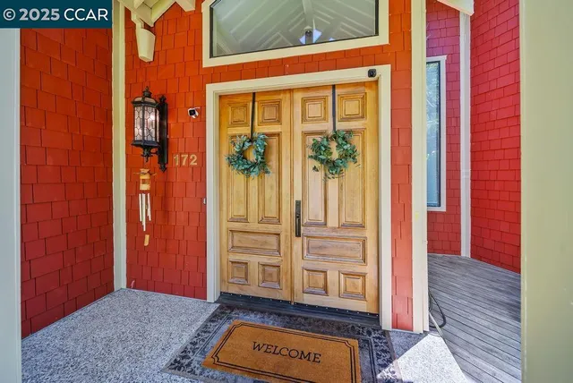 a view of front door with lamp