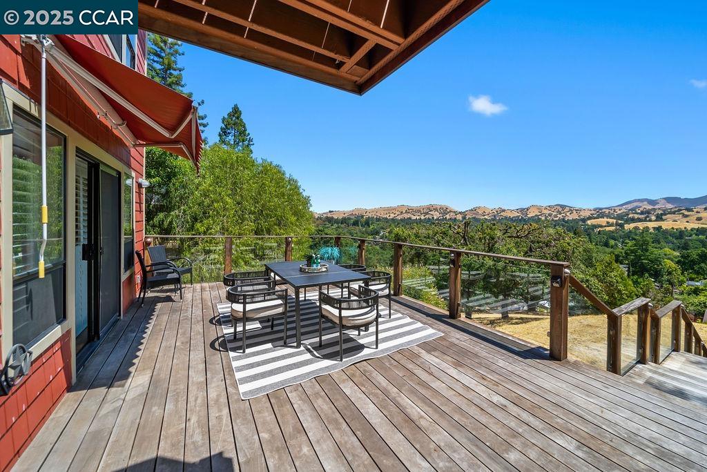172 Rudgear Drive Walnut Creek, CA 94596 - Photo 37 of 51 a view of a balcony with chairs and wooden floor