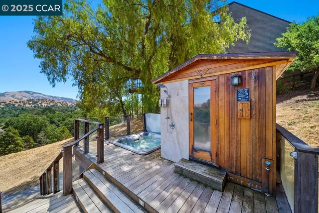 a view of a wooden deck front of house
