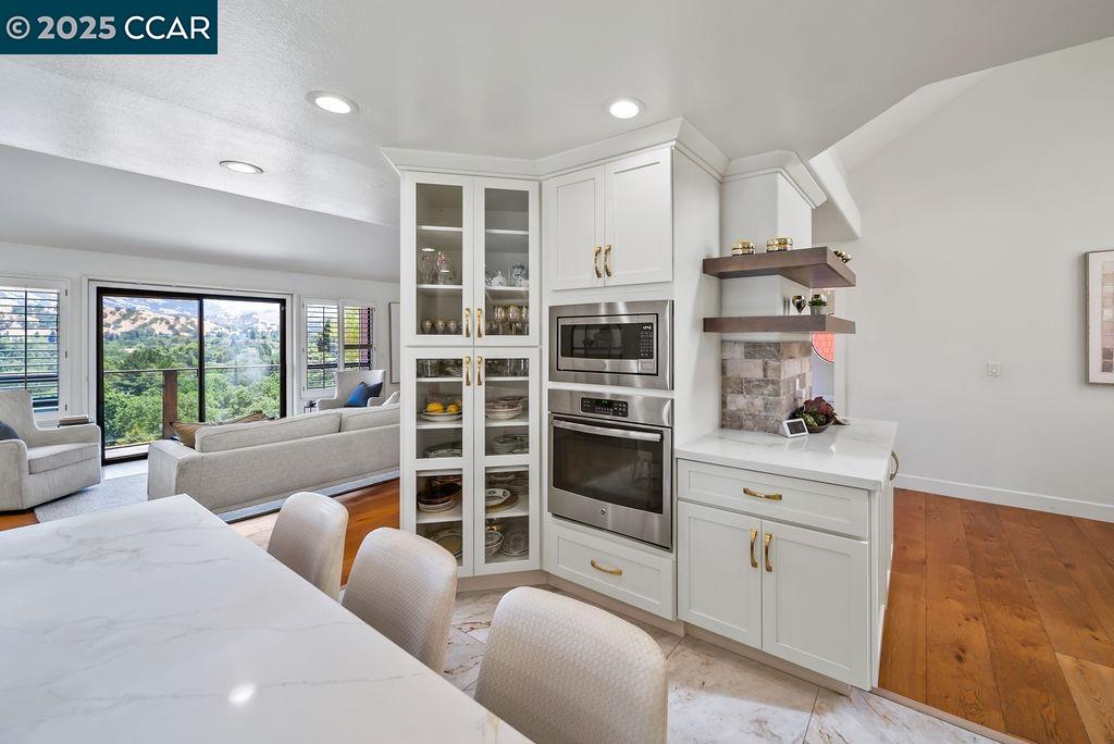 172 Rudgear Drive Walnut Creek, CA 94596 - Photo 7 of 51 a room with furniture a rug and a large window