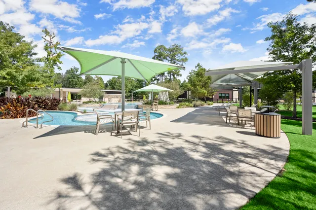 a view of a backyard with sitting area