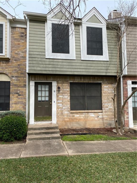 12325 Los Indios Trail, Unit 9 Austin, TX 78729 - Photo 1 of 30 View of front of house with brick siding, entry steps, and a front yard