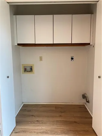a view of room with wooden floor