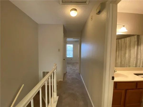 a view of hallway with stairs