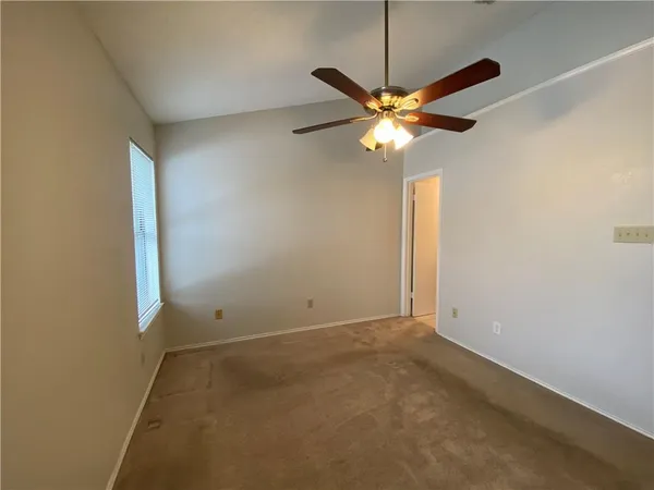 a view of a chandelier fan in a room