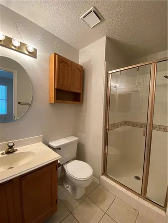 a bathroom with a toilet sink and shower
