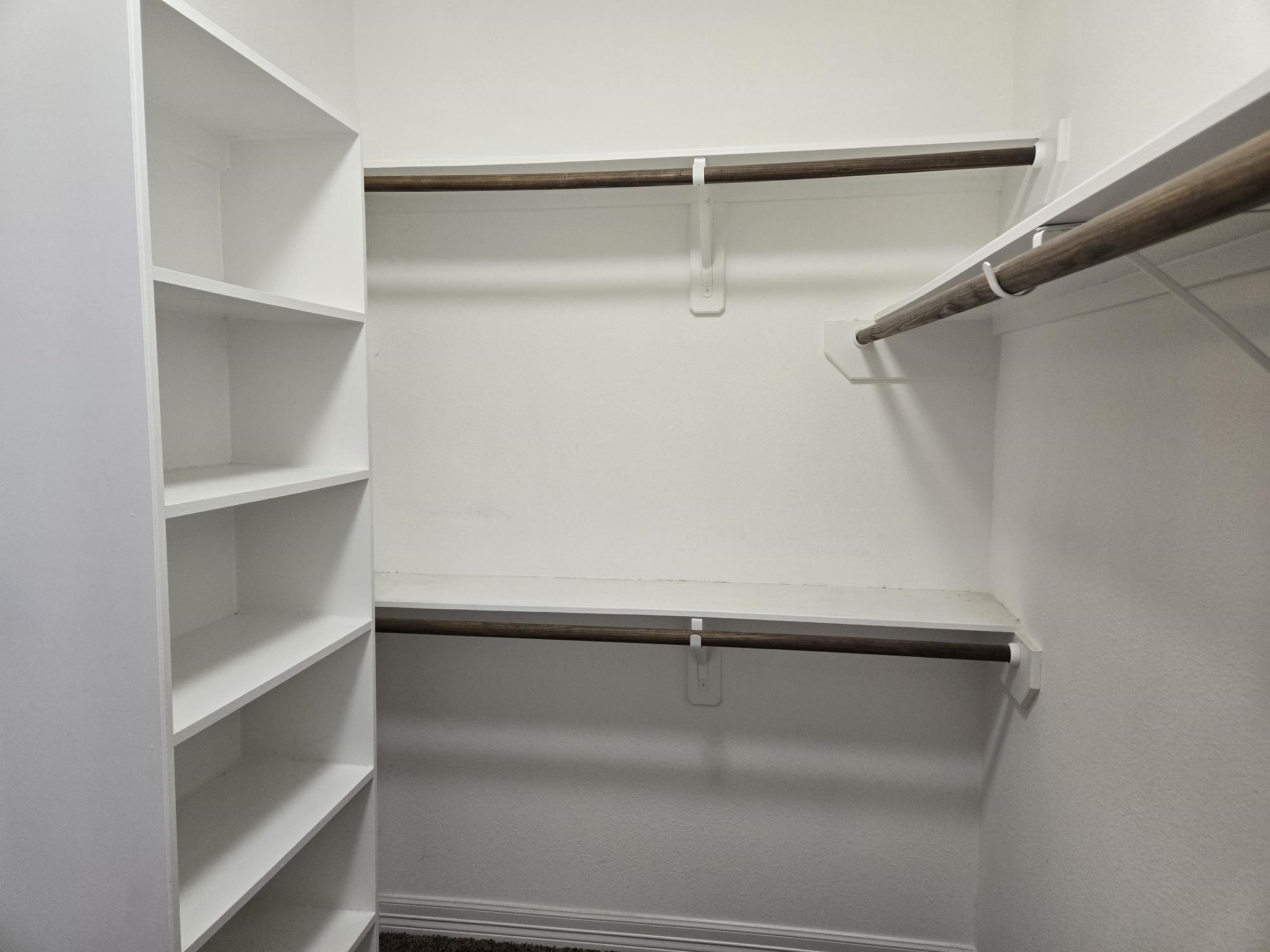 306 Masterson Street Arcola, TX 77583 - Photo 18 of 28 a view of an empty walk in closet