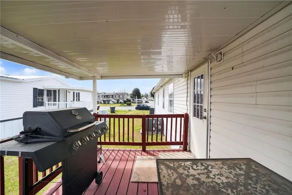 a view of a patio with wooden floor