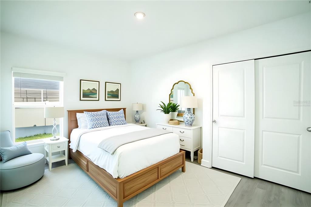 280 Citrine Loop Kissimmee, FL 34758 - Photo 11 of 25 a bedroom with a bed couch and window