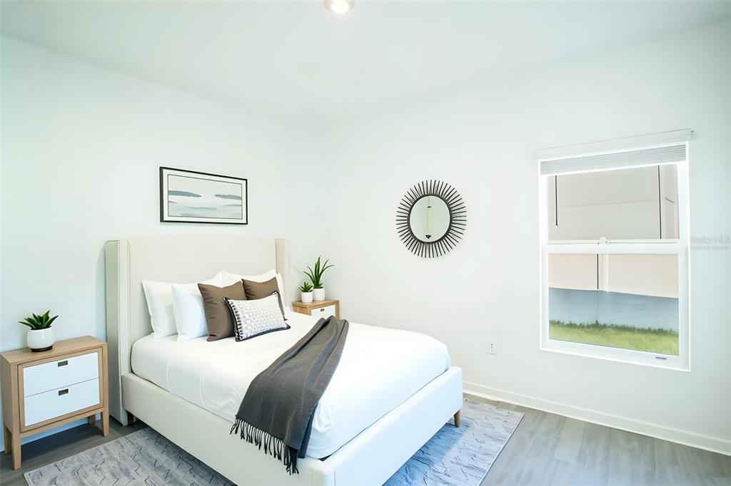 280 Citrine Loop Kissimmee, FL 34758 - Photo 12 of 25 a bedroom with a bed and a window