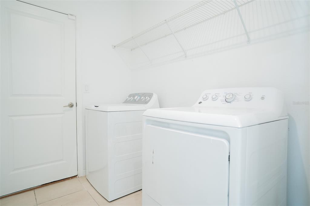 280 Citrine Loop Kissimmee, FL 34758 - Photo 14 of 25 a utility room with dryer and washer