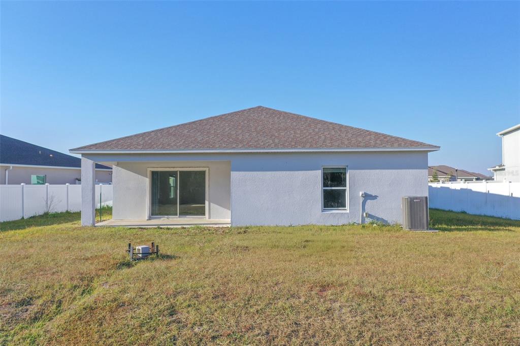 280 Citrine Loop Kissimmee, FL 34758 - Photo 19 of 25 a house view with a garden space