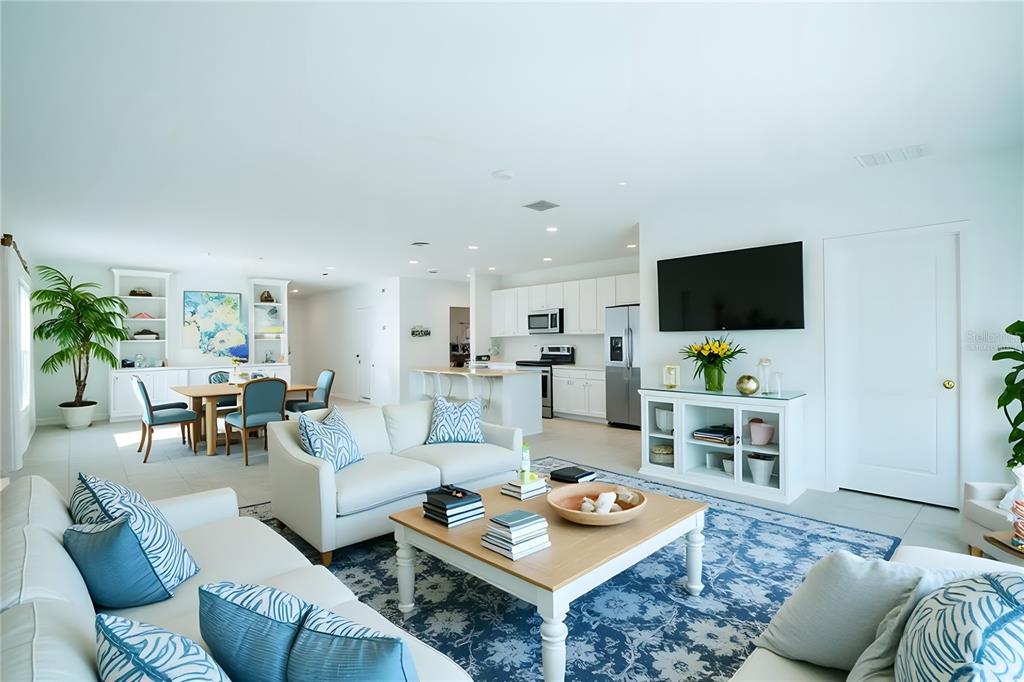 280 Citrine Loop Kissimmee, FL 34758 - Photo 2 of 25 a living room with furniture and a flat screen tv