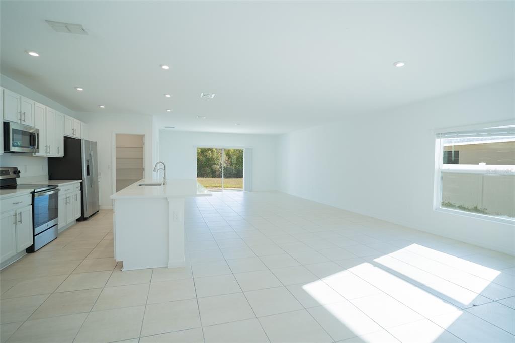 280 Citrine Loop Kissimmee, FL 34758 - Photo 3 of 25 a view of a kitchen with a sink