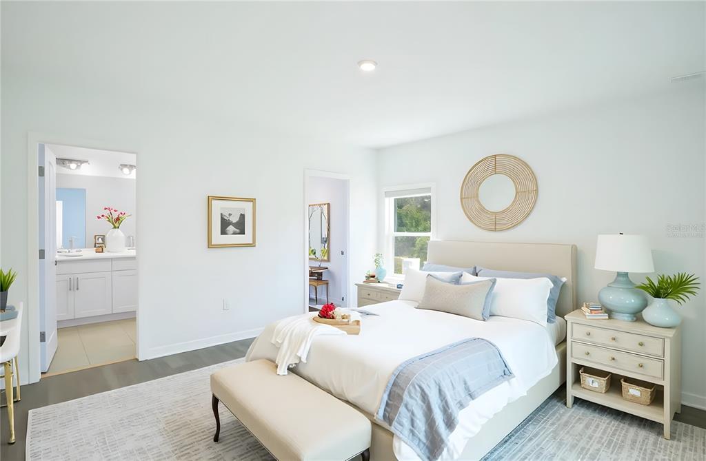 280 Citrine Loop Kissimmee, FL 34758 - Photo 7 of 25 a bedroom with a bed and wooden floor