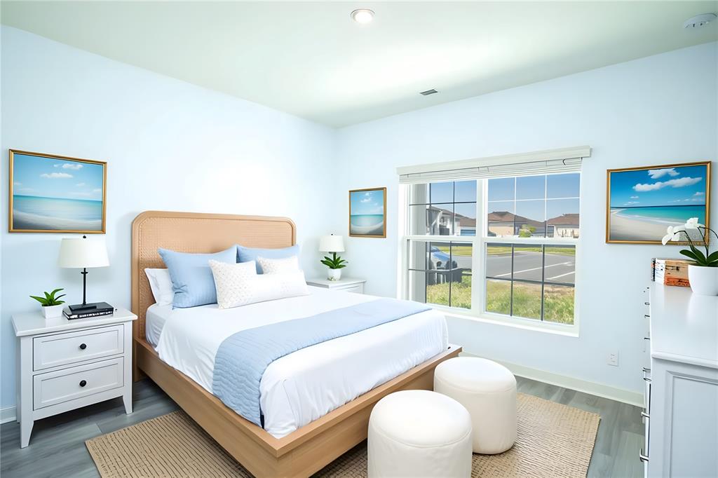 280 Citrine Loop Kissimmee, FL 34758 - Photo 9 of 25 a bedroom with a bed and a large window