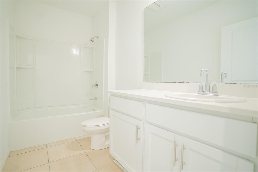 280 Citrine Loop Kissimmee, FL 34758 - Photo 10 of 25 a bathroom with a bathtub and a toilet