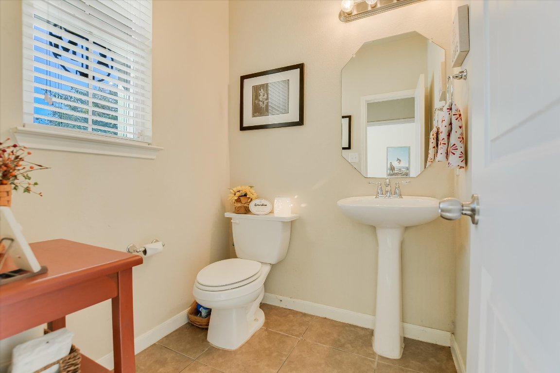 1700 Zilker Drive Cedar Park, TX 78613 - Photo 15 of 19 a bathroom with a toilet sink and mirror