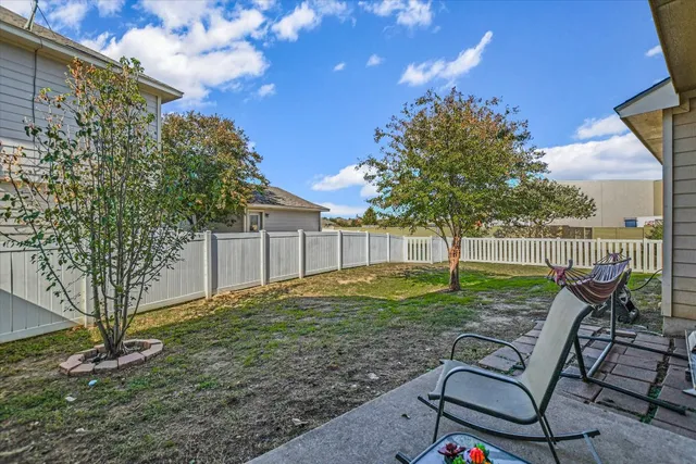 a view of backyard with green space