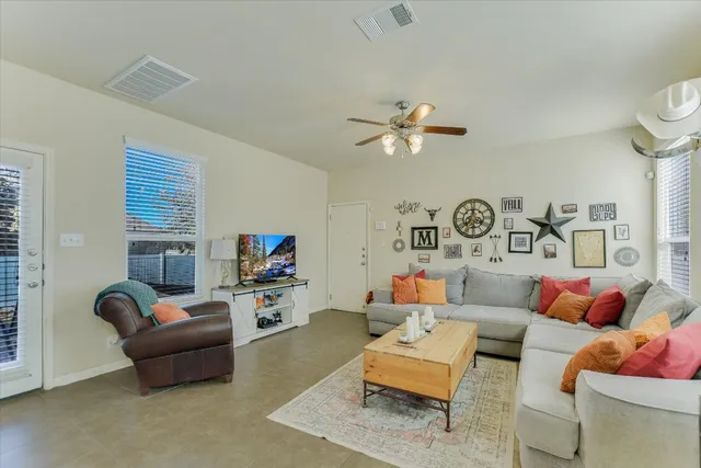 a living room with furniture and a flat screen tv