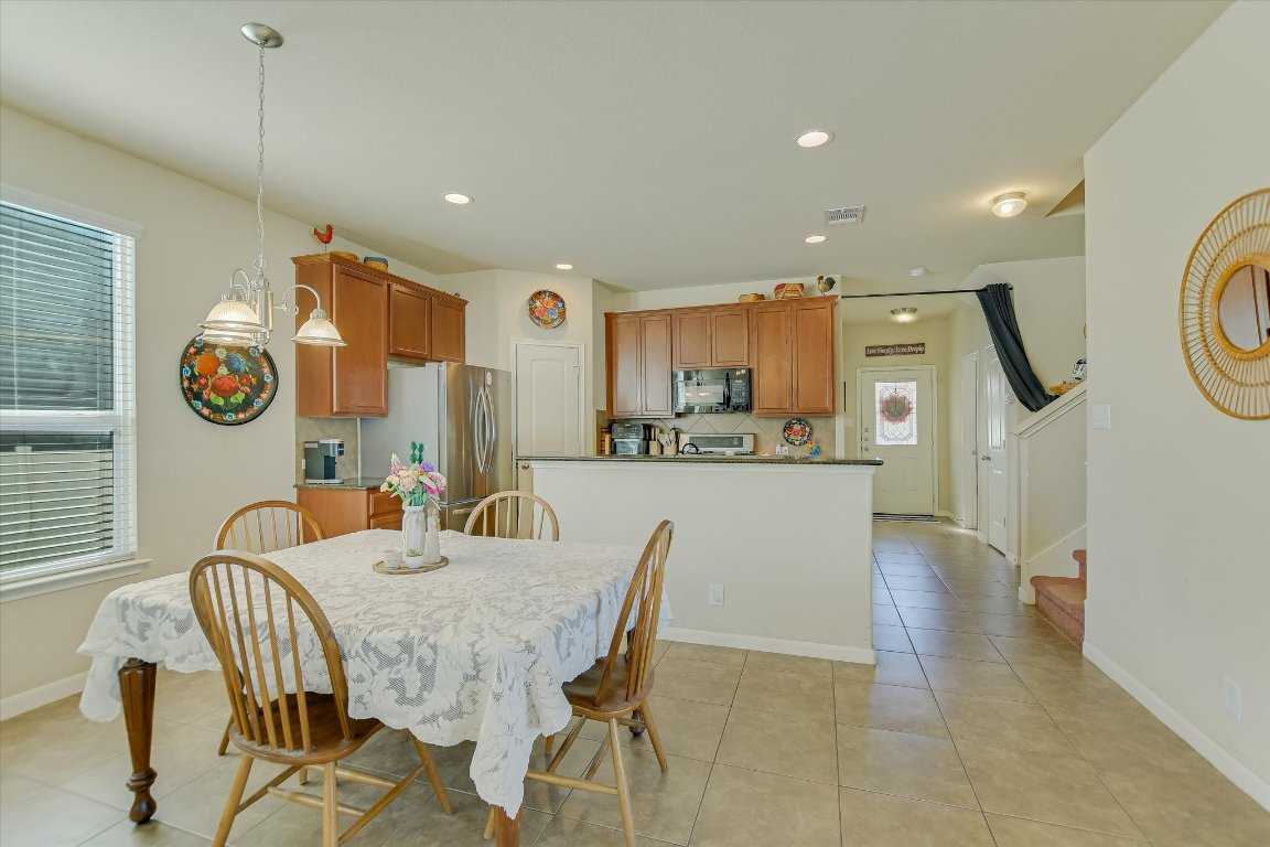 1700 Zilker Drive Cedar Park, TX 78613 - Photo 3 of 19 a dining room with furniture and a window