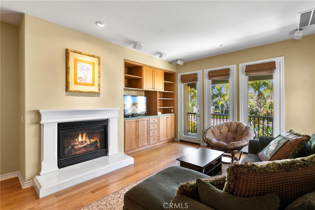 21331 Veleta Circle Huntington Beach, CA 92648 - Photo 1 of 14 a living room with furniture and a fireplace