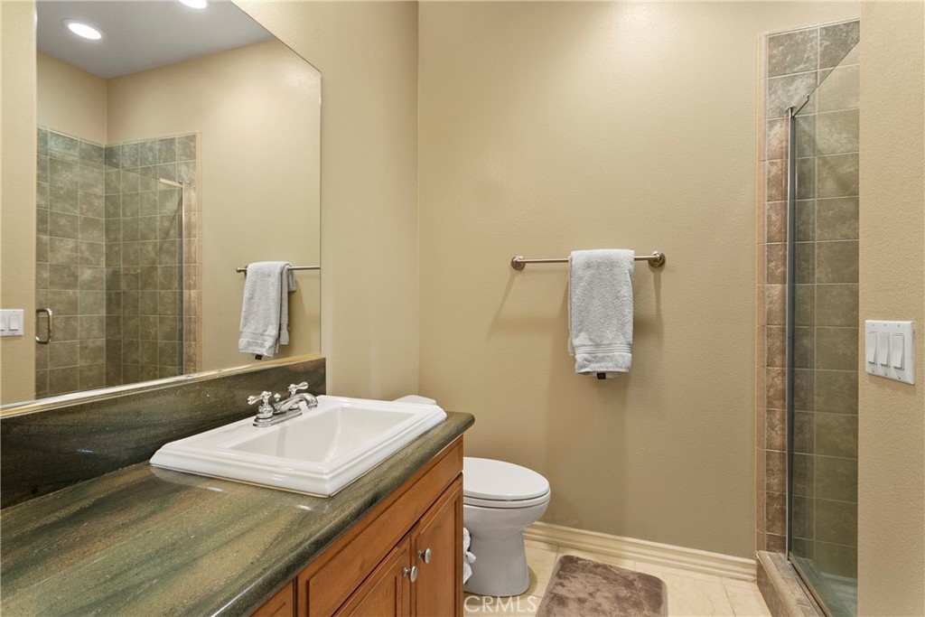 21331 Veleta Circle Huntington Beach, CA 92648 - Photo 12 of 14 a bathroom with a sink toilet and shower